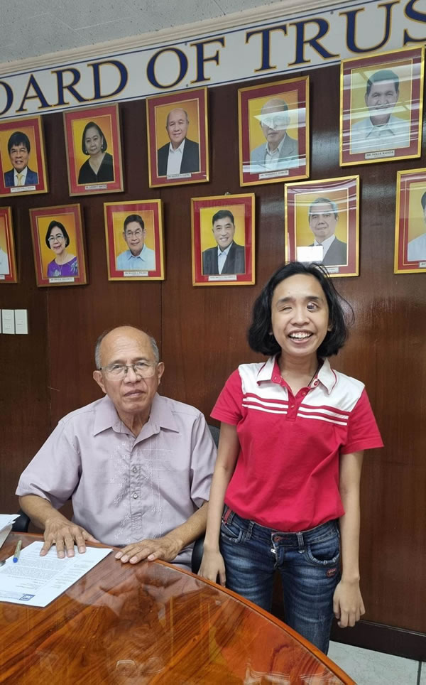Angel Kayle De Sesto with Dr. Robles at the CPU Admin Conference Room after their meeting. 