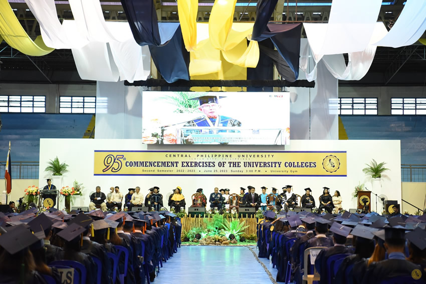 University President Dr. Robles delivers his message to the graduating class of 2023 at the University Gymnasium