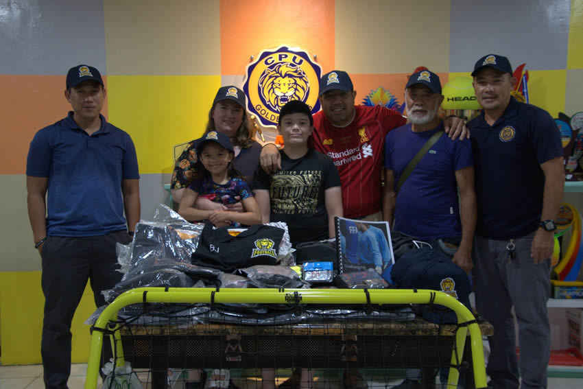Engr. Marc Hermel Agriam (L), Director for Sports and Athletics, together with Mr. Bob Rommel Javellana (R) received the donation of sports equipment from Bryan Apura and his family.