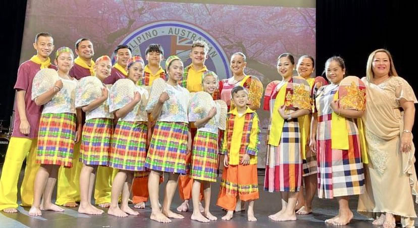 Dr. Magno (rightmost) with Fil-Australian dancers in Filipiniana custume